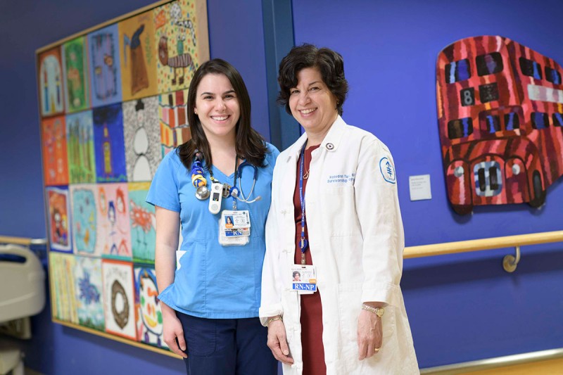 Gabriella and Roseann Tucci pose on a Pediatrics floor