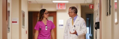 MSK surgeon Julio Garcia-Aguilar and nurse Gina Occhiogross walk down a hallway