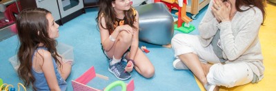 MSK acting teacher Jenny Solomon with two children