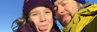 father and daughter in selfie taken outdoors 